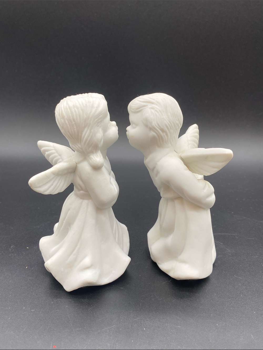 Bisque white ceramic angels- approximately 4” tall